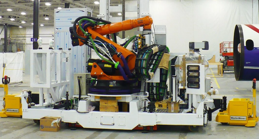 Tracteur pousseur Mastermover déplacemt d'un robot ABB